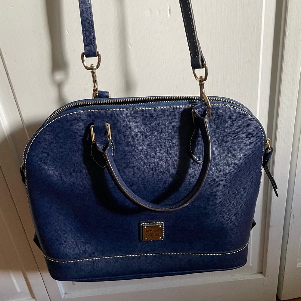 Dooney & Bourke navy handbag. New, never used. With strap and handles.